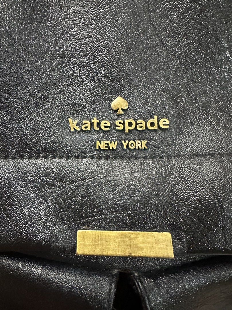 Kate Spade New York Black Backpack Convertible (Category: Backpacks) located in Batangas. Submitted by jhinp0t (Listing ID 1436231316, Image 2). Description: Genuine Leather Black Kate Spade backpack with two front pockets. Features a top handle and adjustable shoulder straps. The interior has a Kate Spade label and a zipper pocket. The zipper pull has the Kate Spade logo. The backpack has gold-tone hardware. Issue: This is my project bag brought