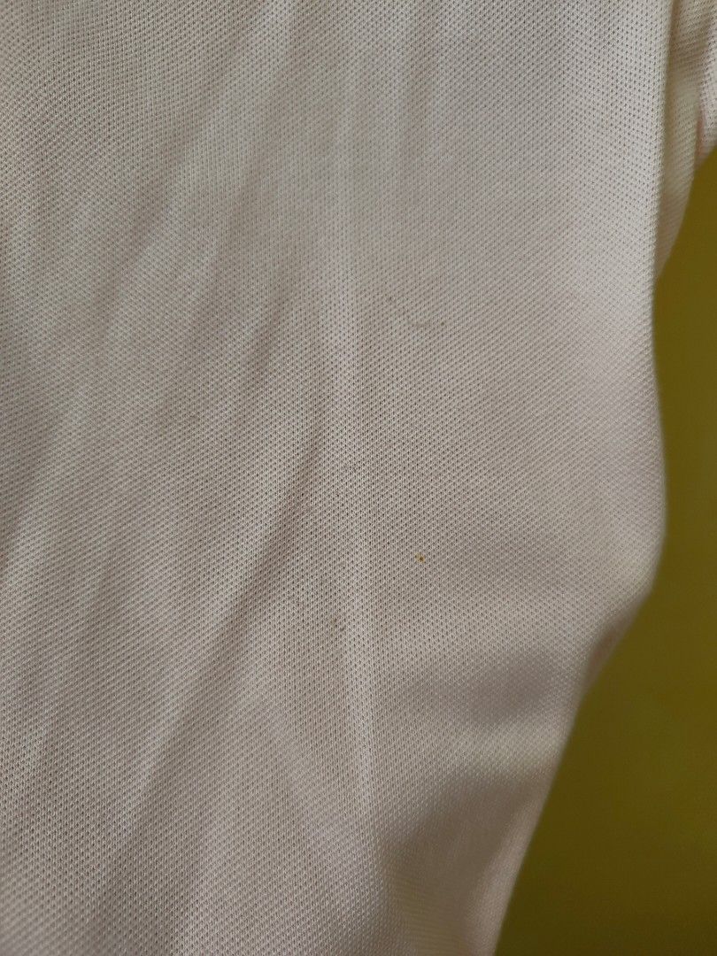 Lacoste Light Pink Polo Shirt (Category: Shirts) located in Quezon City. Submitted by teleh.reyes (Listing ID 1436118658, Image 2). Description: - Authentic Lacoste polo shirt - Soft pink color - Size 42 - Iconic Lacoste crocodile logo - Classic polo collar - Button-up closure - Comfortable fabric - with spots on one side due to being unused.