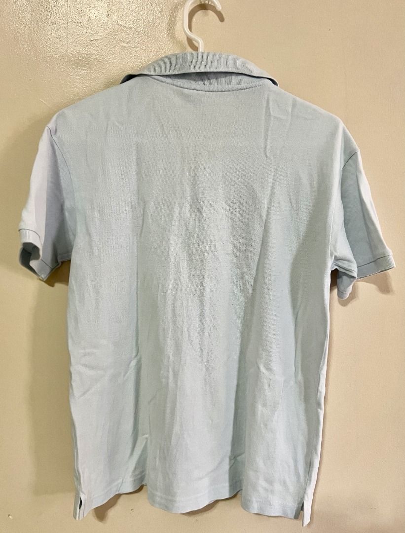 LACOSTE Polo Shirt - Light Blue (Category: Tshirts & Polo Shirts ) located in Taguig. Submitted by LessThan (Listing ID 1436231367, Image 2). Description: Lacoste polo shirt Light blue Size: Body (18" x 24" inches), Sleeves (7" x 6"-8" inches) - Classic polo collar and short sleeves - Made in Peru, designed in France - Button-up placket.