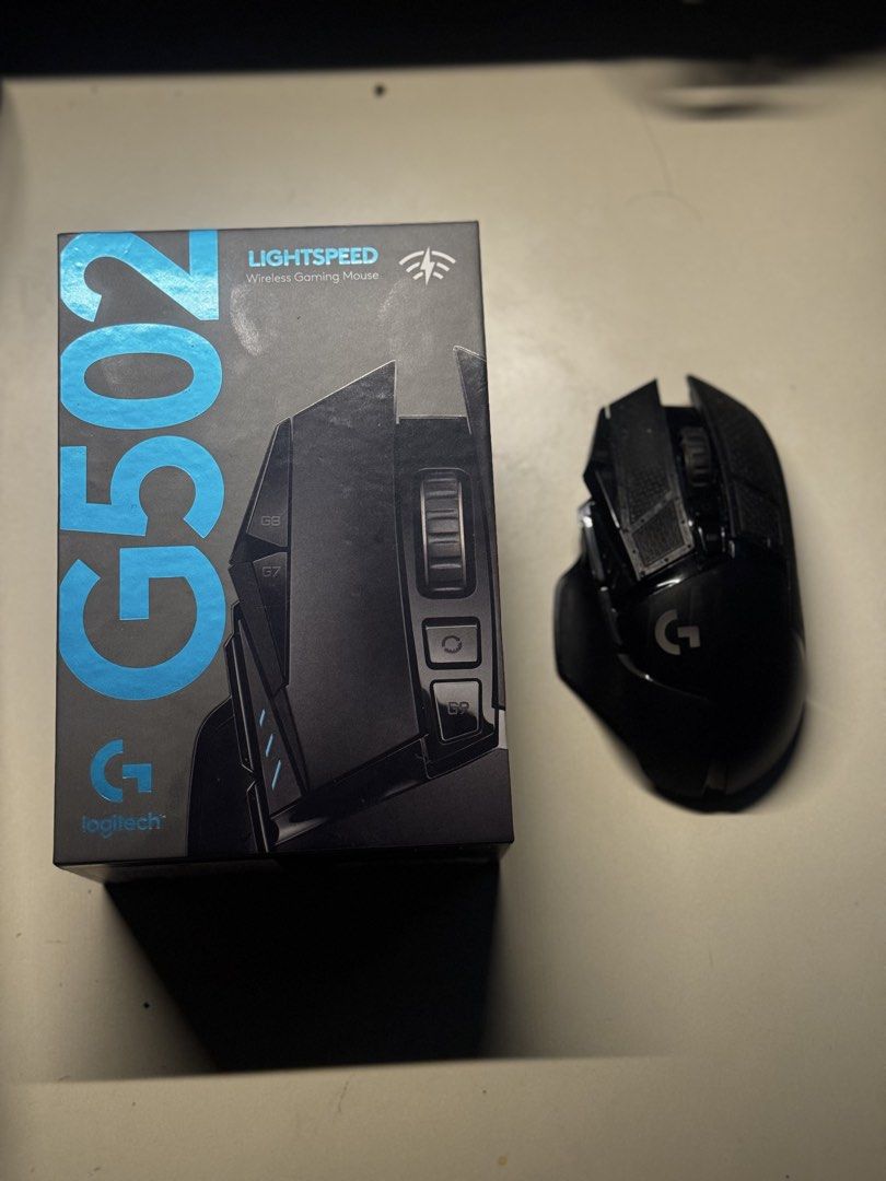 Logitech G502 Wireless Gaming Mouse (Category: Mouse & Mousepads) located in Marilao. Submitted by miguelsanti (Listing ID 1436233056, Image 1). Description: In good physical condition, no defects/issue Box still in good condition with receipt, all accessories (cable, dongle, weights) 3rd party dock and XL desk mousepad included.