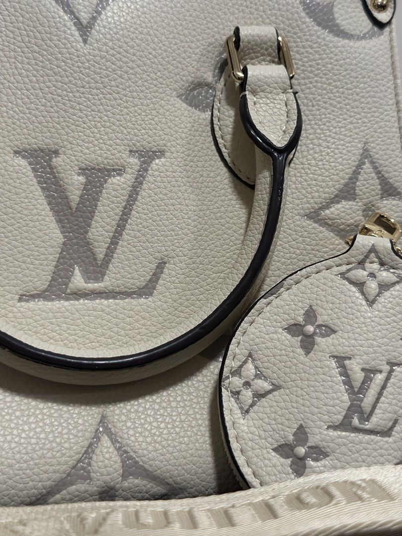 Louis Vuitton Monogram Empreinte Bag (Cream/Off-White) (Category: Luxury Bags & Wallets) located in Manila. Submitted by carlalobet64203 (Listing ID 1436259603, Image 2). Description: Elegant and classy Louis Vuitton handbag in a beautiful cream/off-white color with oversized monogram print. Comes with matching round coin pouch and adjustable strap — perfect for both hand carry and crossbody use. Condition: Pre-loved, in good condition * Exterior
