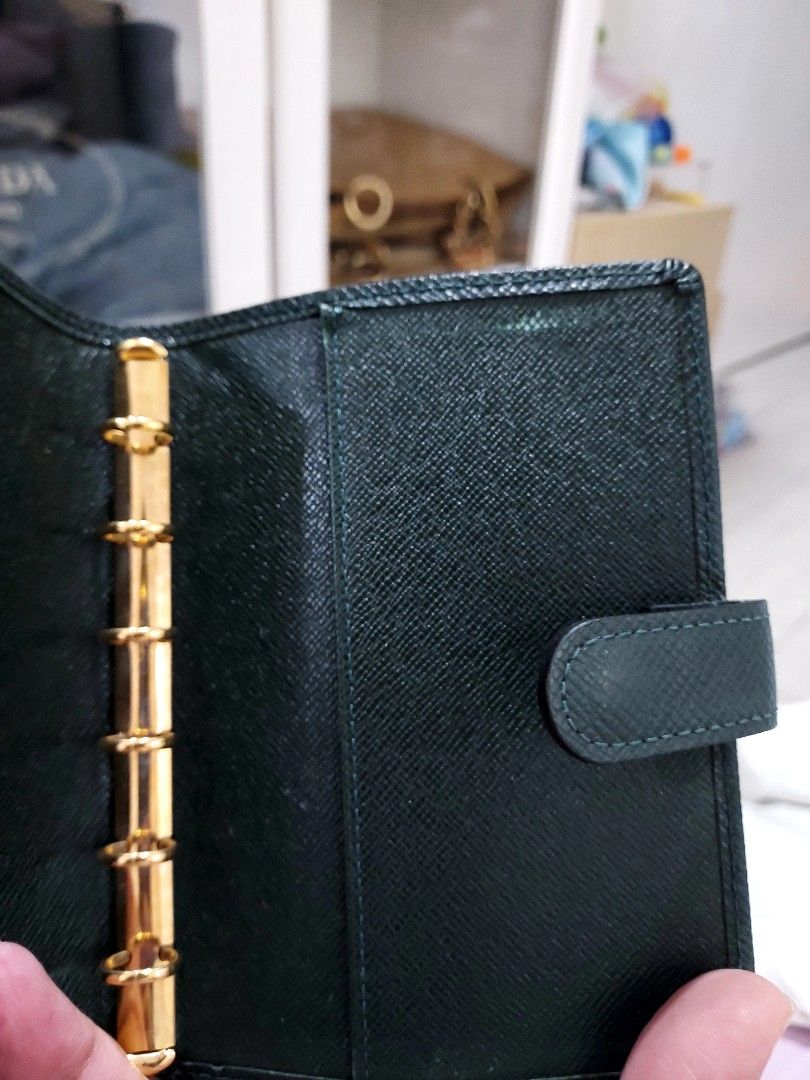 LV Agenda pm (Category: Luxury Bags & Wallets) located in Paranaque City. Submitted by andim8 (Listing ID 1436189943, Image 3). Description: LV Agenda, with card slots in Taiga Leather still in very good conditon a little liquis paper stain inside but manageable.