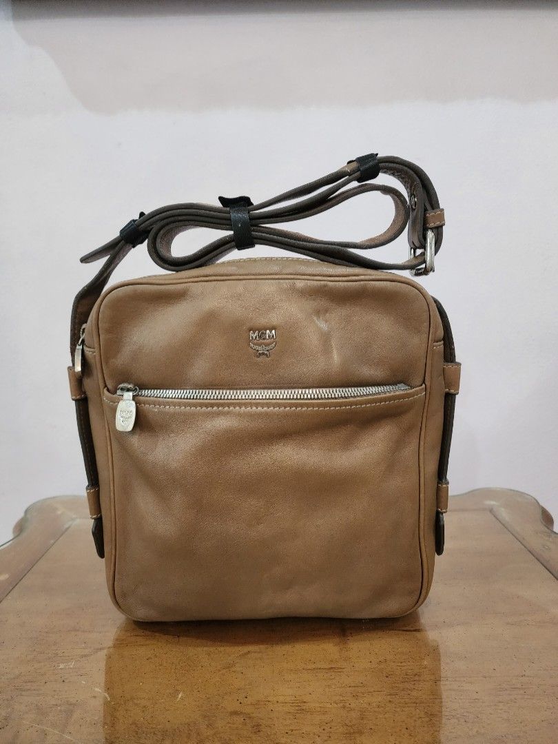 Mcm Men's Sling (Category: Luxury Bags & Wallets) located in Valenzuela. Submitted by absolutelychick (Listing ID 1324744476, Image 1). Description: L 9" x W 2.5" x H 9.75" Yung color po nito para po siyang olive green na tan. meron pong fade sa hardwares and near sa zipper konting press mark sa body please check photos for reference jrs, lbc, j&t lalamove/grab ready.