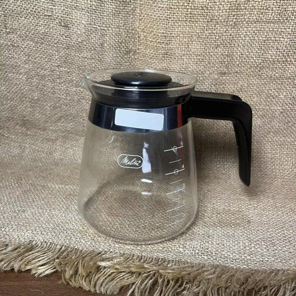 Melitta Coffee Maker Carafe (Category: Coffee Machines & Makers) located in Bulacan. Submitted by ceramicscubby (Listing ID 1436172902, Image 1). Description: Size: 3.75 D x 5.1 H in. ❗️CLOSING DOWN SALE, ALL PRICES ARE MARKED DOWN. WE WILL NOT BE ACCEPTING OFFERS LOWER THAN OUR ASKING PRICE. ❗️ - Melitta coffee maker carafe - Black handle and lid - Measurement markings on the side - Minor rust present.