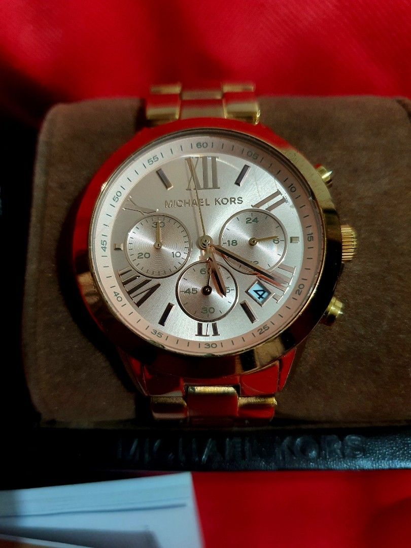 Michael Kors Chronograph Watch MK-5778 (Category: Women's Watches) located in Manila. Submitted by happymountain_3bc4f7 (Listing ID 1436215453, Image 2). Description: - Michael Kors chronograph watch - Gold-tone stainless steel - Model: MK-5778 - Roman numeral hour markers - Three sub-dials - Includes original box - Includes paperwork - Includes extra links -with signs of usage.
