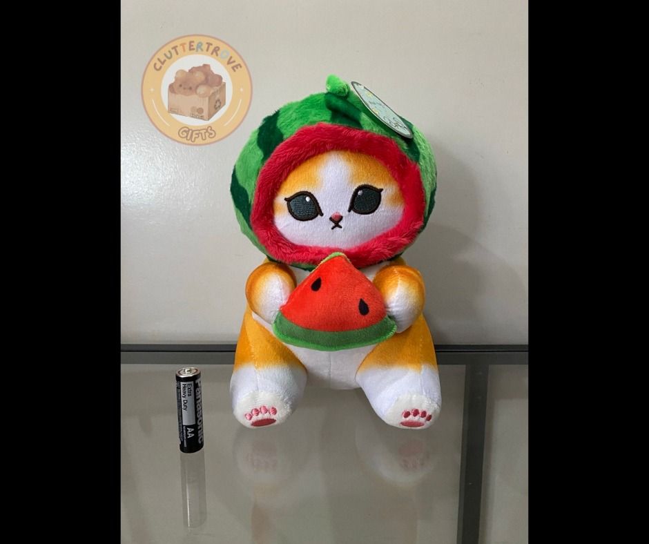 Mofusand Orange Watermelon Cat [Unofficial] (Category: Plushies & Soft Toys) located in Mabalacat. Submitted by cluttertrove (Listing ID 1436275622, Image 1). Description: ⊹₊⟡⋆ 𝐏𝐫𝐢𝐜𝐞: 𝐏𝐇𝐏 𝟏𝟓𝟎 ⊹₊⟡⋆ ⤷ Condition: Like-new ⤷ Details: - Can be suctioned to display in your car - Approximately 8.5 inches For any questions, please send a message~ (˶◜ᵕ◝˶).