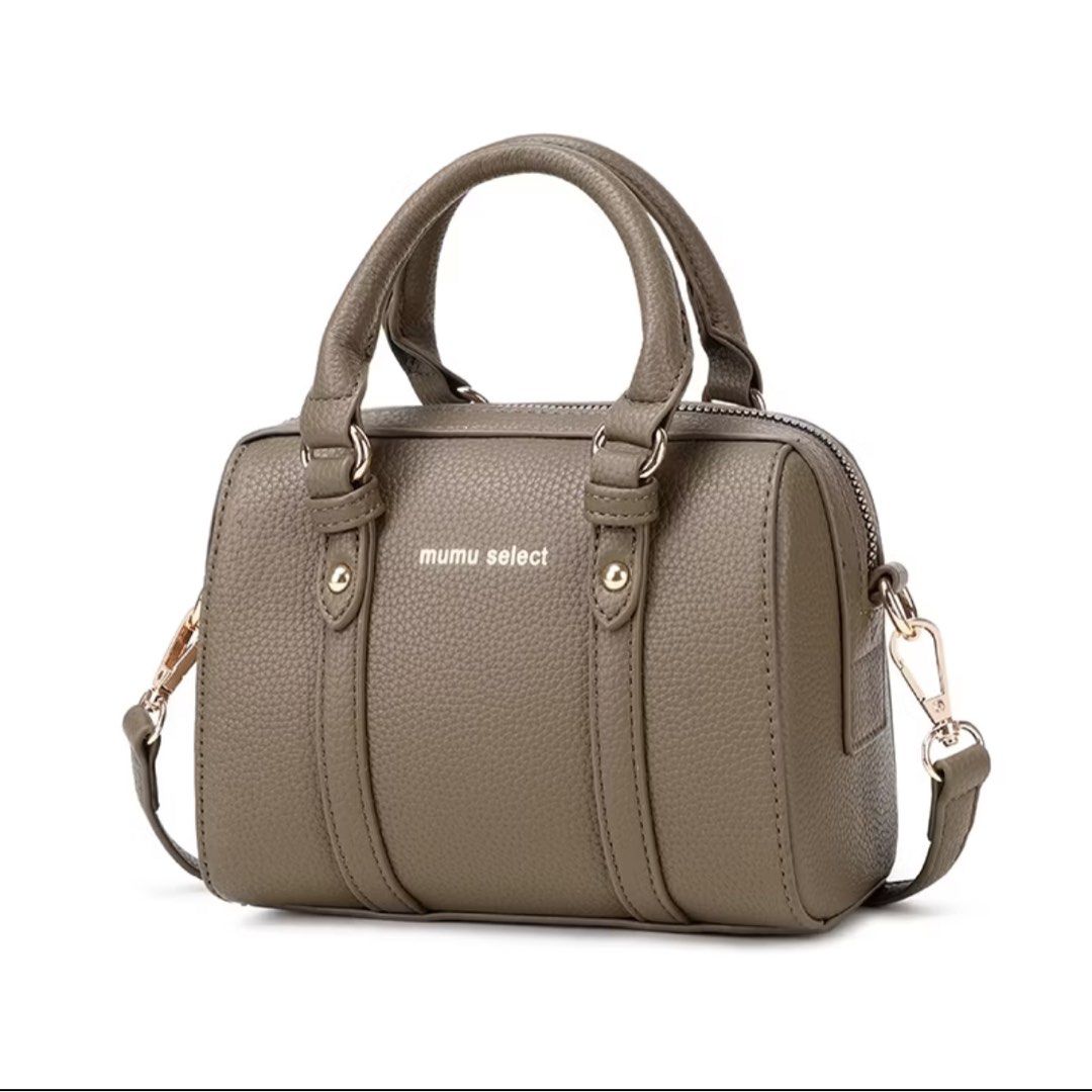 Mumu Select Cylinder Handbag with Strap (Category: Shoulder Bags) located in Manila. Submitted by emsmerize (Listing ID 1436197193, Image 2). Description: - Mumu Select cylinder handbag - Detachable shoulder strap and top handle - Textured exterior with buckle details - Includes a small dog keychain - Perfect for everyday or special occasions - Comes with original tag.