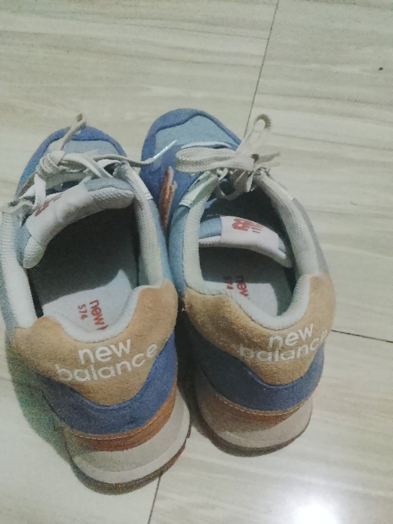 New Balance 574 Blue Sneakers (Category: Sneakers) located in Manila. Submitted by freestone.411e2d (Listing ID 1436202548, Image 3). Description: - New Balance 574 sneakers - Blue and orange color scheme - New Balance logo on side and heel - White laces.