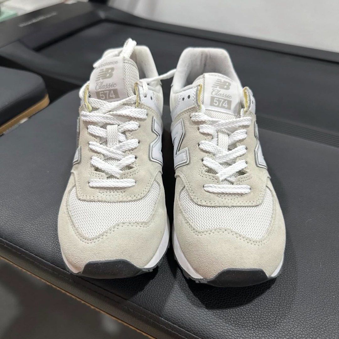 New Balance 574 Classic Sneakers (Category: Sneakers) located in Antipolo. Submitted by nikki.sells (Listing ID 1436103775, Image 3). Description: - New Balance 574 - Neutral colorway - Suede and mesh upper - Iconic 'N' logo - Cushioned midsole for comfort - Black soles - White laces - New Balance branding on heel - Used once (mall walking) - True to size - Size: US W 8; US M 6.5; EU 39; 25cm - No box￼.