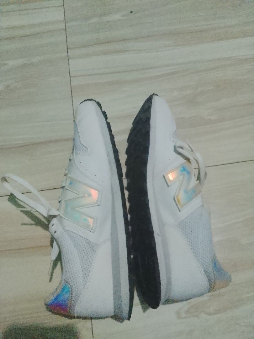 New Balance 574 White Sneakers (Category: Sneakers) located in Manila. Submitted by freestone.411e2d (Listing ID 1436201978, Image 3). Description: - New Balance 574 sneakers - Color: White - Mesh upper - Iridescent accents on heel and New Balance logo - "Comfort Insole" branding - White laces - White midsole - Black outsole - Pre-owned condition.