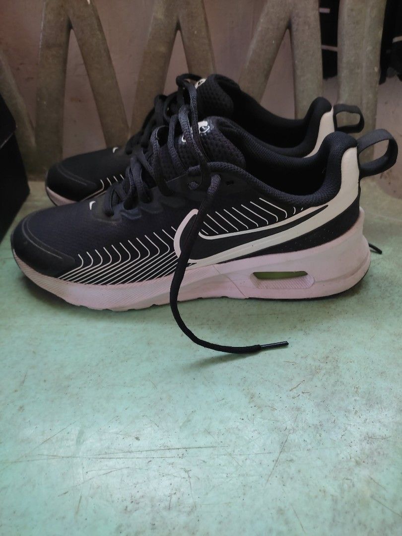 Nike Air Max Sneakers Black (Category: Sneakers) located in Agdangan. Submitted by 004arci (Listing ID 1436225801, Image 2). Description: - Black Nike Air Max sneakers - Black upper with white accents - White sole - Nike logo on the side - Lace-up closure - Padded collar for comfort - Air Max logo on the tongue.