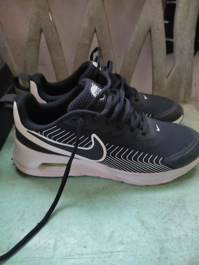 Nike Air Max Sneakers Black (Category: Sneakers) located in Agdangan. Submitted by 004arci (Listing ID 1436225801, Image 1). Description: - Black Nike Air Max sneakers - Black upper with white accents - White sole - Nike logo on the side - Lace-up closure - Padded collar for comfort - Air Max logo on the tongue.