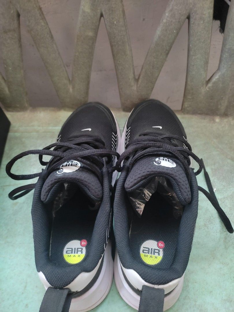 Nike Air Max Sneakers Black (Category: Sneakers) located in Agdangan. Submitted by 004arci (Listing ID 1436225801, Image 3). Description: - Black Nike Air Max sneakers - Black upper with white accents - White sole - Nike logo on the side - Lace-up closure - Padded collar for comfort - Air Max logo on the tongue.