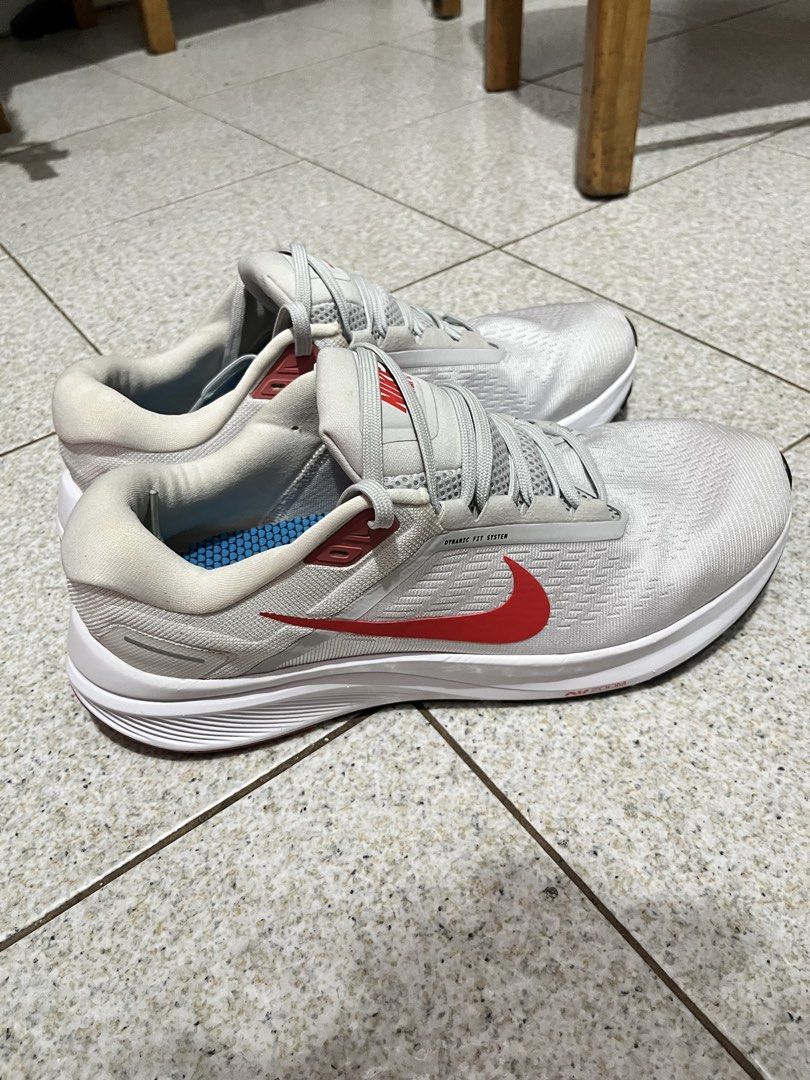 Nike Air Zoom Structure 24 Running Shoes (Category: Sneakers) located in Pasig City. Submitted by emsans (Listing ID 1436117946, Image 2). Description: - Nike Air Zoom Structure 24 - Color: White with red accents - Features: Lace-up closure, Nike swoosh logo Brand New but no box.