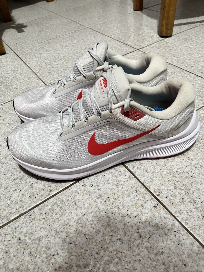 Nike Air Zoom Structure 24 Running Shoes (Category: Sneakers) located in Pasig City. Submitted by emsans (Listing ID 1436117946, Image 1). Description: - Nike Air Zoom Structure 24 - Color: White with red accents - Features: Lace-up closure, Nike swoosh logo Brand New but no box.