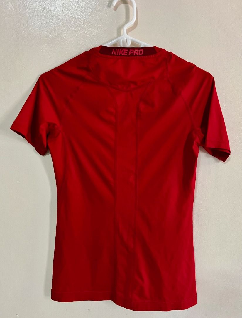 Nike Pro Dri-fit Compression Shirt - Red (Category: Tshirts & Polo Shirts ) located in Taguig. Submitted by LessThan (Listing ID 1436233600, Image 2). Description: Nike Pro Dri-fit Compression Shirt Color Red Size when not expanded: Body (15" x 25-26" inches), Sleeves (5" x 5"-6" inches) - White Nike logo on the front - Nike Pro logo on collar - breathable ribbed panel/mesh-type fabric on back - Made with performance fabric - Perfect for training