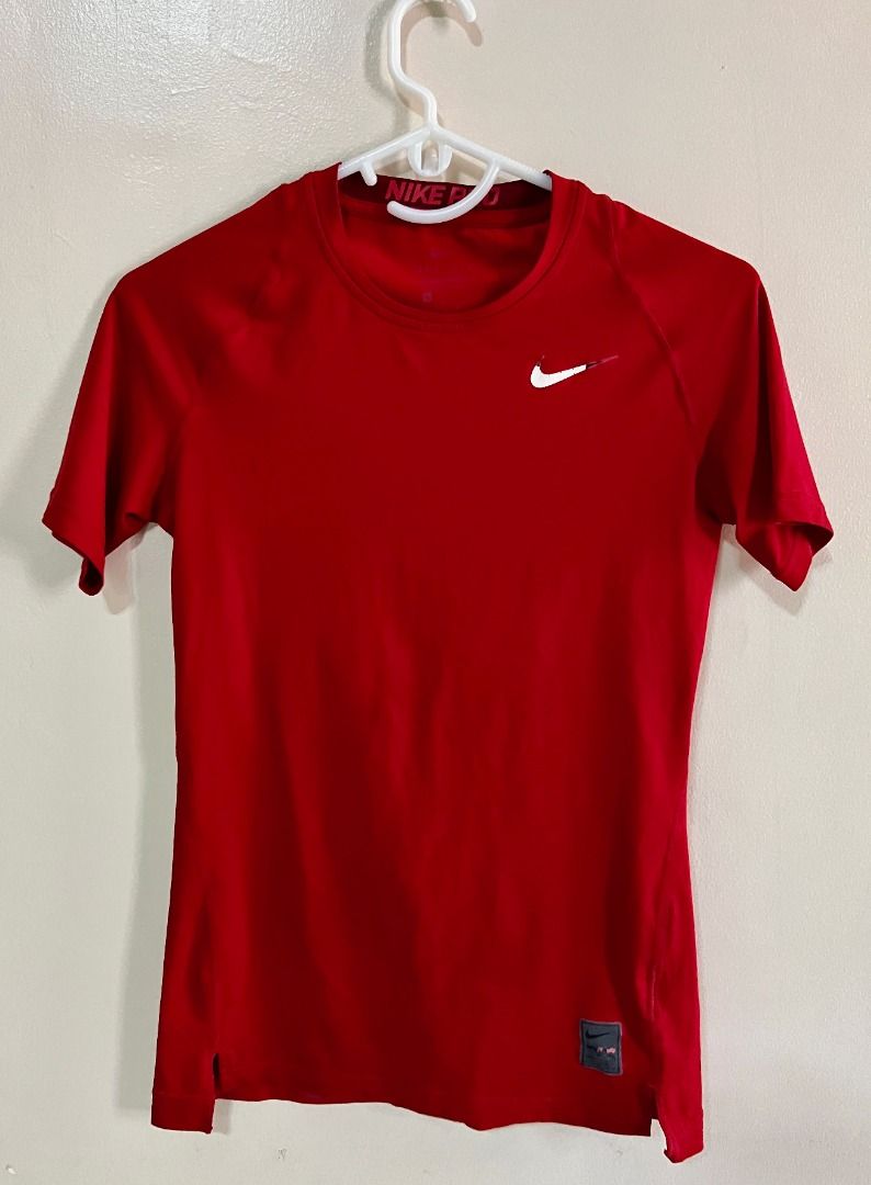 Nike Pro Dri-fit Compression Shirt - Red (Category: Tshirts & Polo Shirts ) located in Taguig. Submitted by LessThan (Listing ID 1436233600, Image 1). Description: Nike Pro Dri-fit Compression Shirt Color Red Size when not expanded: Body (15" x 25-26" inches), Sleeves (5" x 5"-6" inches) - White Nike logo on the front - Nike Pro logo on collar - breathable ribbed panel/mesh-type fabric on back - Made with performance fabric - Perfect for training
