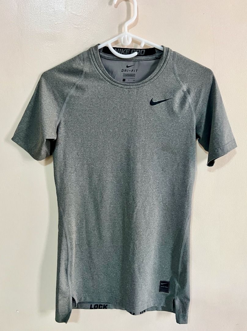 Nike Pro Dri-fit Compression Shirt - Gray (Category: Tshirts & Polo Shirts ) located in Taguig. Submitted by LessThan (Listing ID 1436234053, Image 1). Description: Nike Pro Dri-fit Compression Shirt Color Gray Size when not expanded: Body (15" x 25-26" inches), Sleeves (5" x 5"-6" inches) - White Nike logo on the front - Nike Pro logo on collar - breathable ribbed panel/mesh-type fabric on back - Made with performance fabric - Perfect for traini