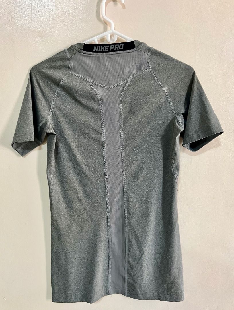 Nike Pro Dri-fit Compression Shirt - Gray (Category: Tshirts & Polo Shirts ) located in Taguig. Submitted by LessThan (Listing ID 1436234053, Image 2). Description: Nike Pro Dri-fit Compression Shirt Color Gray Size when not expanded: Body (15" x 25-26" inches), Sleeves (5" x 5"-6" inches) - White Nike logo on the front - Nike Pro logo on collar - breathable ribbed panel/mesh-type fabric on back - Made with performance fabric - Perfect for traini