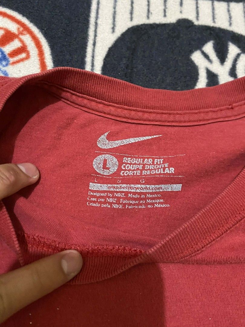 Nike Red T-Shirt with White Logo (Category: Tshirts & Polo Shirts ) located in Taguig. Submitted by cabugchear34421 (Listing ID 1436274135, Image 2). Description: - Red Nike t-shirt - White Nike logo - Crew neck, short sleeves - Size: Large - Fit: Regular - Made in Mexico.