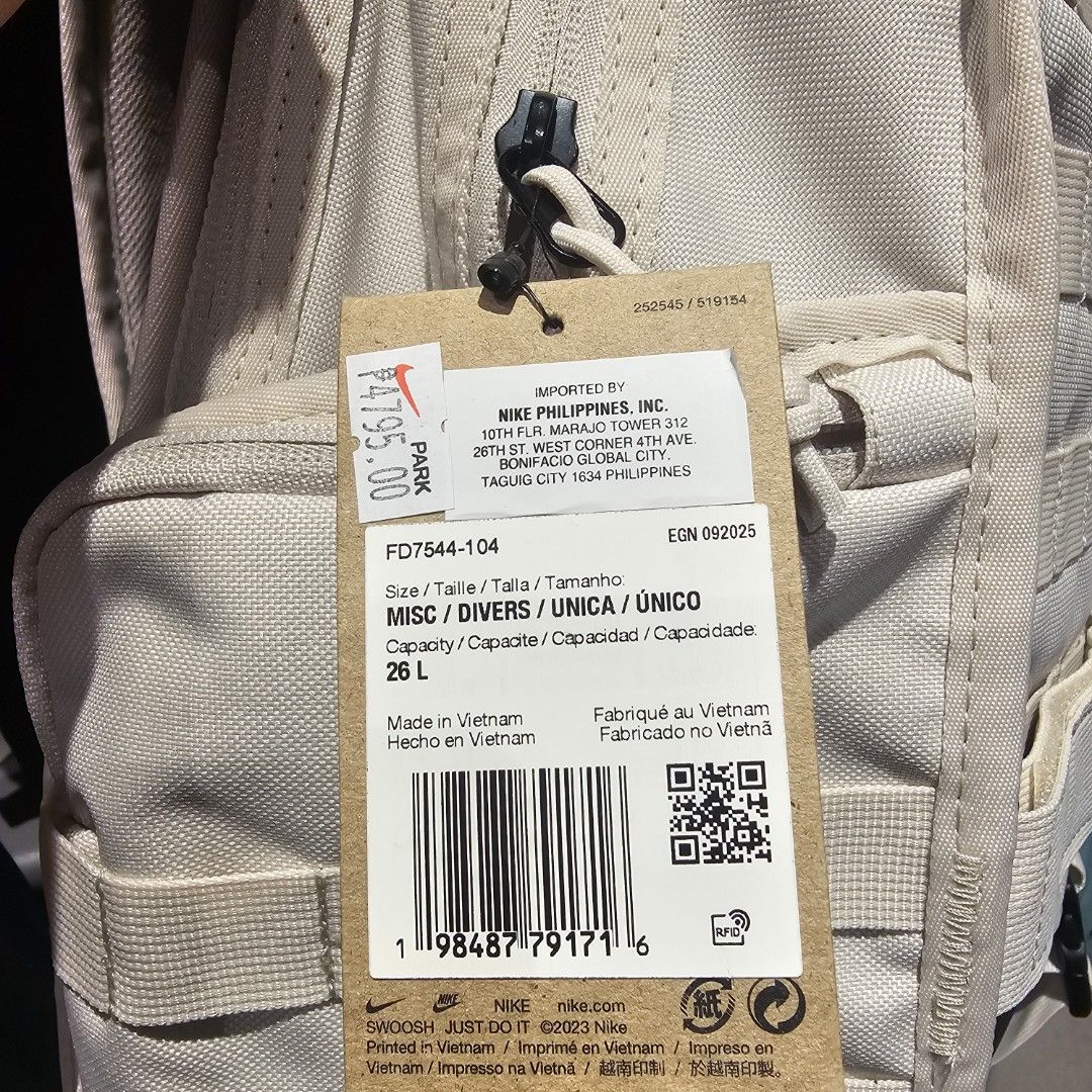 Nike RPM Backpack FD7544-104 26L (Category: Backpacks) located in Quezon City. Submitted by northernlegends (Listing ID 1436282462, Image 1). Description: - Nike backpack - 26L capacity - Beige exterior with black accents - Nike logo - Multiple straps and zippers - Original price tag attached - Made in Vietnam.