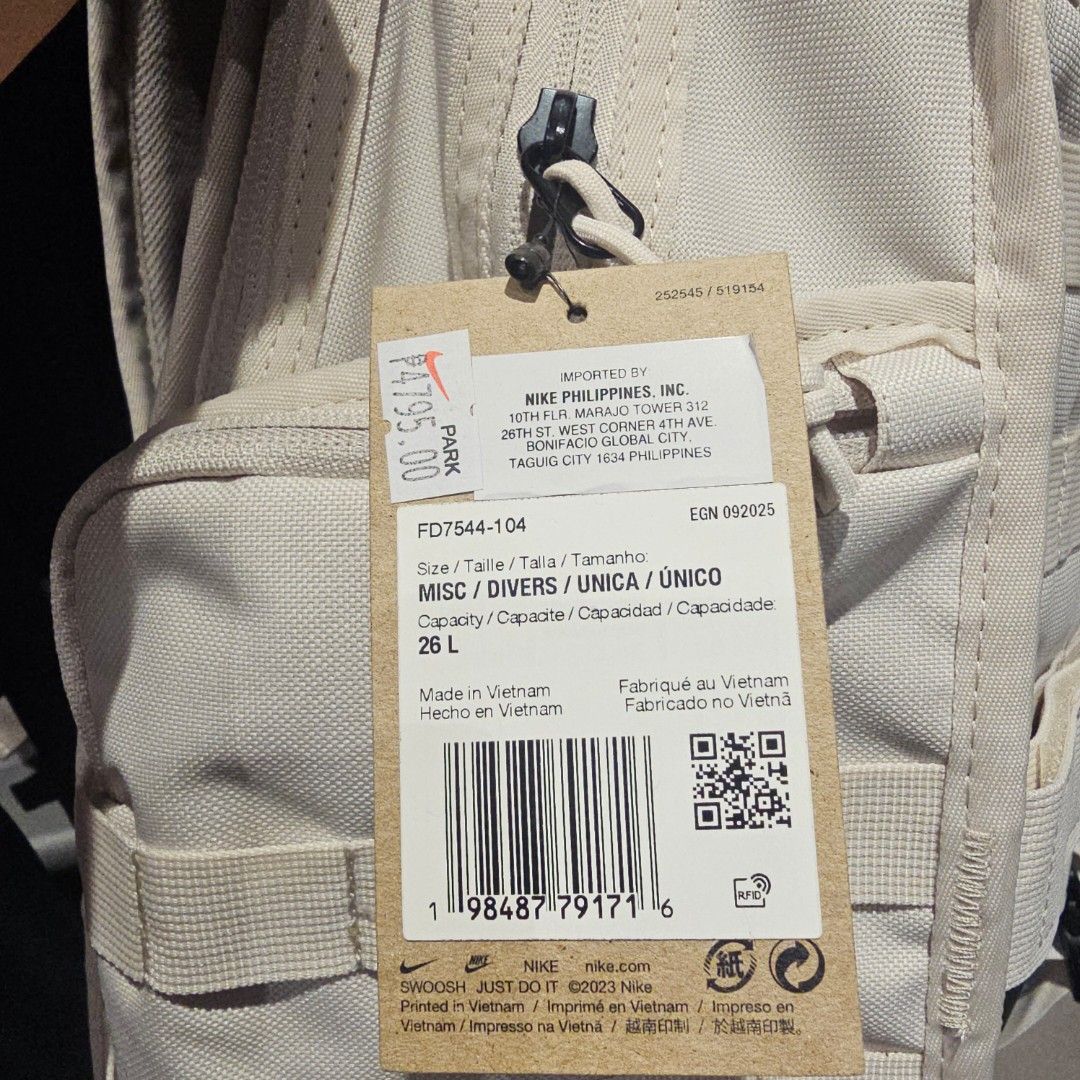 Nike RPM Backpack FD7544-104 26L (Category: Backpacks) located in Quezon City. Submitted by northernlegends (Listing ID 1436282462, Image 3). Description: - Nike backpack - 26L capacity - Beige exterior with black accents - Nike logo - Multiple straps and zippers - Original price tag attached - Made in Vietnam.