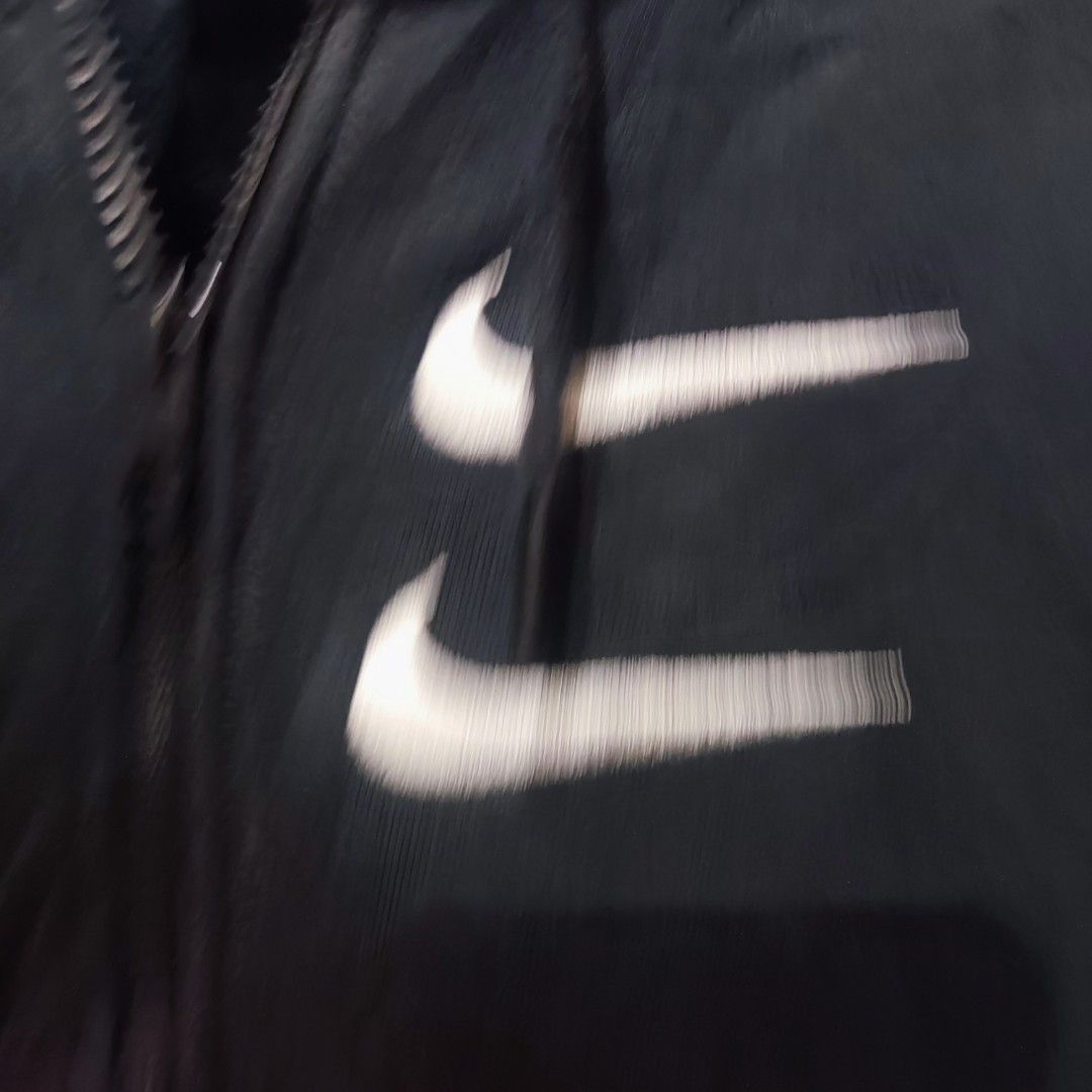 Nike Swoosh Hoodie (Category: Coats, Jackets and Outerwear) located in San Mateo. Submitted by sweetys_closet (Listing ID 1436276619, Image 2). Description: - Navy blue Nike hoodie - White Swoosh logo on front - Full zip closure - Hooded - Front pocket - Embroidered "SWOOSH" in red - Double Swoosh logo on chest.