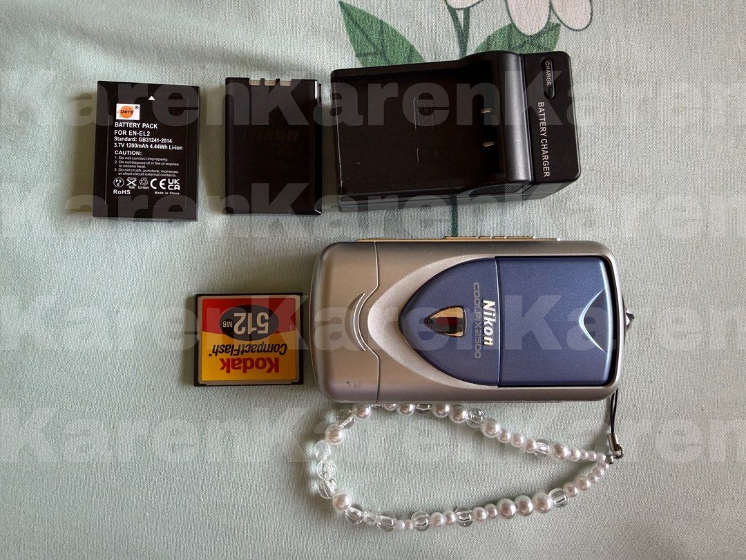 Nikon Coolpix E2500 Digital Camera (Category: Cameras) located in Bulacan. Submitted by youarenot (Listing ID 1436282400, Image 1). Description: NOT FOR SWAPPING/TRADE Rare Camera! Nikon Coolpix E2500 Announced February 2002 Unique swivel lens; clear film-like output despite it being a 2 megapixel camera -Bought from Marketplace -Multiple scene modes and filters With white balance adjustments -Flash and video mode working. No issues! Inclusions: 