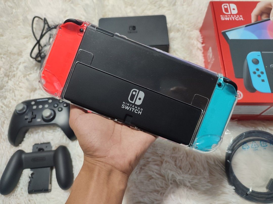 Nintendo Switch OLED Jailbreak (Category: Nintendo) located in Manila. Submitted by plsbuymyswitch.pls (Listing ID 1436174197, Image 3). Description: Nintendo Switch OLED ✅Permanent jailbreak dualboot ✅Complete accessories w/box and receipt ✅With wireless gamepad ✅With case and hard pouch ✅Tempered glass installed ✅No issue, less than a year old.
