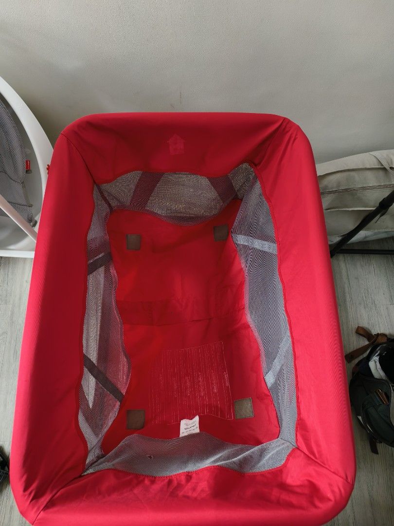 Nuna Sena Playard (Category: Cots & Cribs) located in Calamba. Submitted by junethomasb (Listing ID 1436159142, Image 3). Description: - Nuna Sena playard (red color) - Mesh sides - Includes padded mattress - Foldable design for easy storage and transport - Minor fabric tears present.
