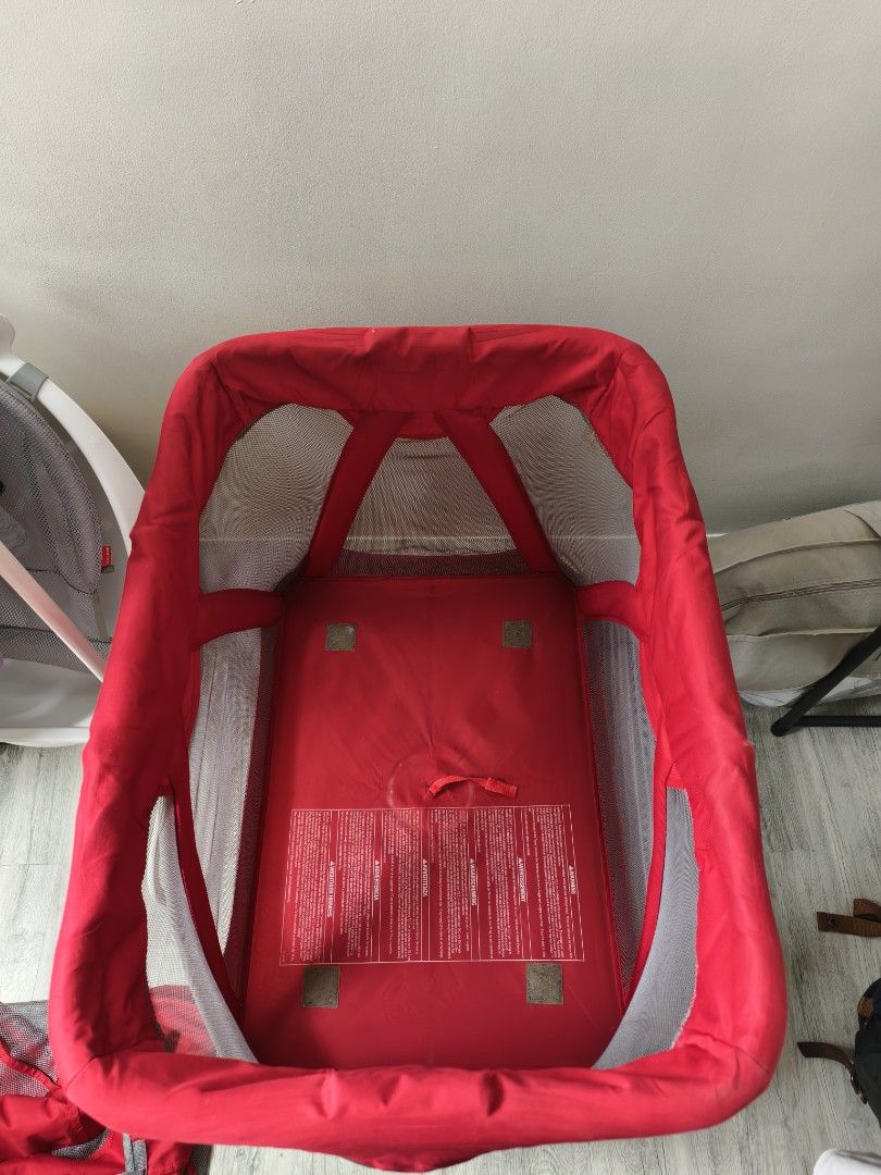 Nuna Sena Playard (Category: Cots & Cribs) located in Calamba. Submitted by junethomasb (Listing ID 1436159142, Image 1). Description: - Nuna Sena playard (red color) - Mesh sides - Includes padded mattress - Foldable design for easy storage and transport - Minor fabric tears present.