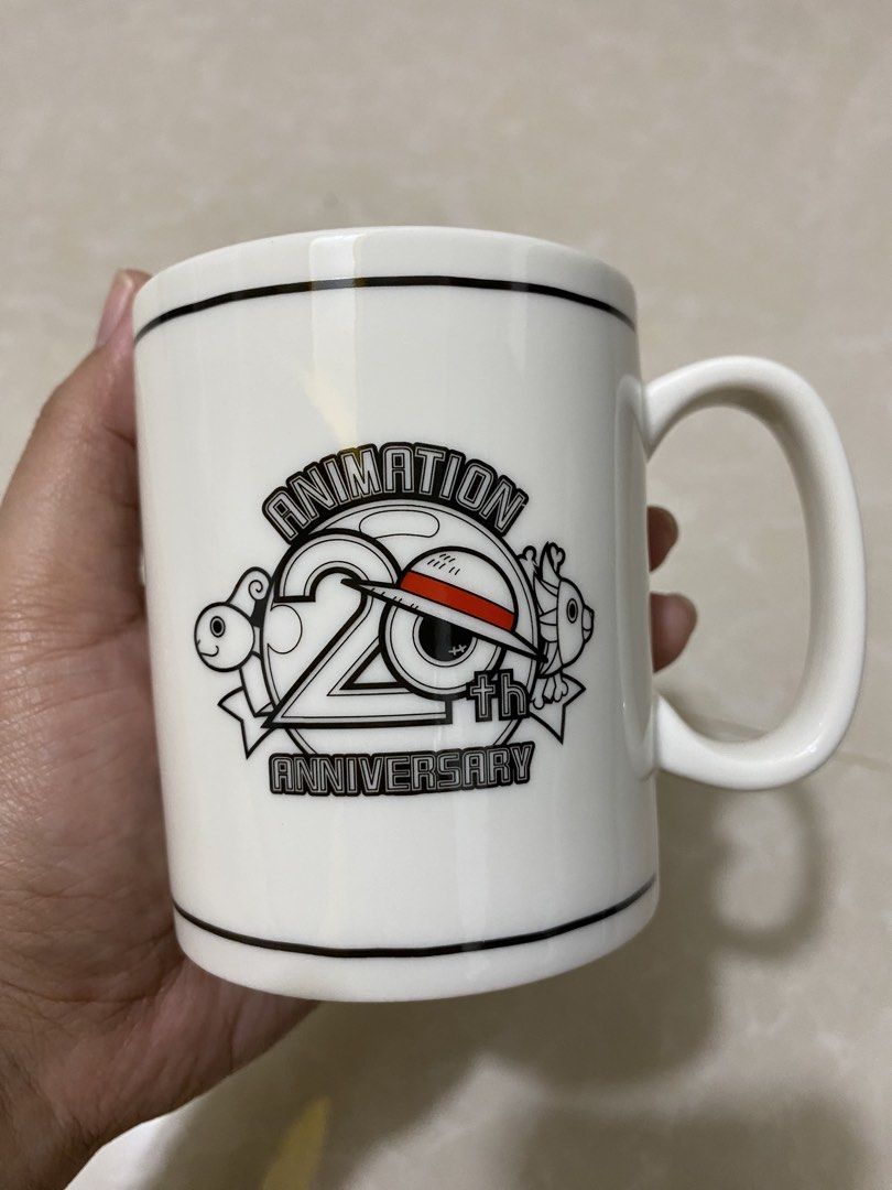 One Piece 20th Anniversary Mug (Category: Coffee & Tea Tableware) located in Makati City. Submitted by lasthing.22 (Listing ID 1436265452, Image 1). Description: Good as new. No issue. Collectible. MOP: Gcash/Bank Transfer MOD: Lalamove/J&T.