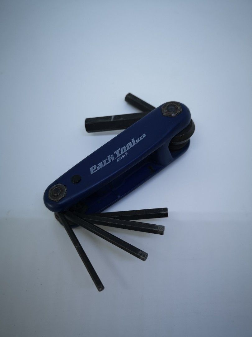Park Tool AWS-11 Fold-Up Hex Wrench Set. (Category: Bicycles) located in Manila. Submitted by isko_sarisari (Listing ID 1436109640, Image 2). Description: Tool Composition: The set features 6 distinct wrench sizes, specifically 3, 4, 5, 6, 8, and 10 mm. Material and Design: The wrenches are constructed from hardened, tempered industrial tool steel, while the handle is made of a durable, slip-resistant composite material. Intended Use: This foldin