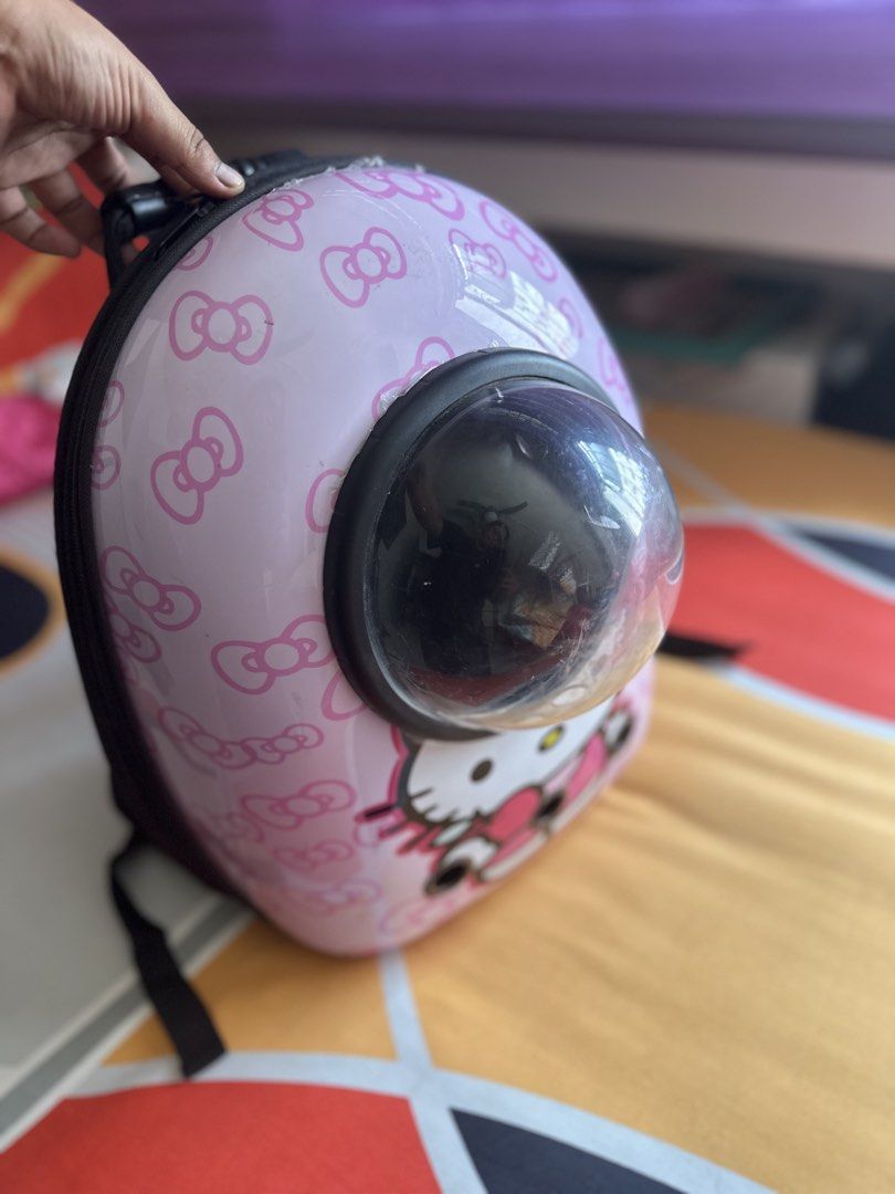 Pet backpack carrier (Category: Homes & Other Pet Accessories) located in Singapore. Submitted by elvirafae20 (Listing ID 1436144885, Image 1). Description: Hello kitty pet backpack - Selling as my maine coon cat can't fit in anymore - Have functional zip, pockets. - Just a few scratches on the peeping window. Will sanitize for you before handing it over. .