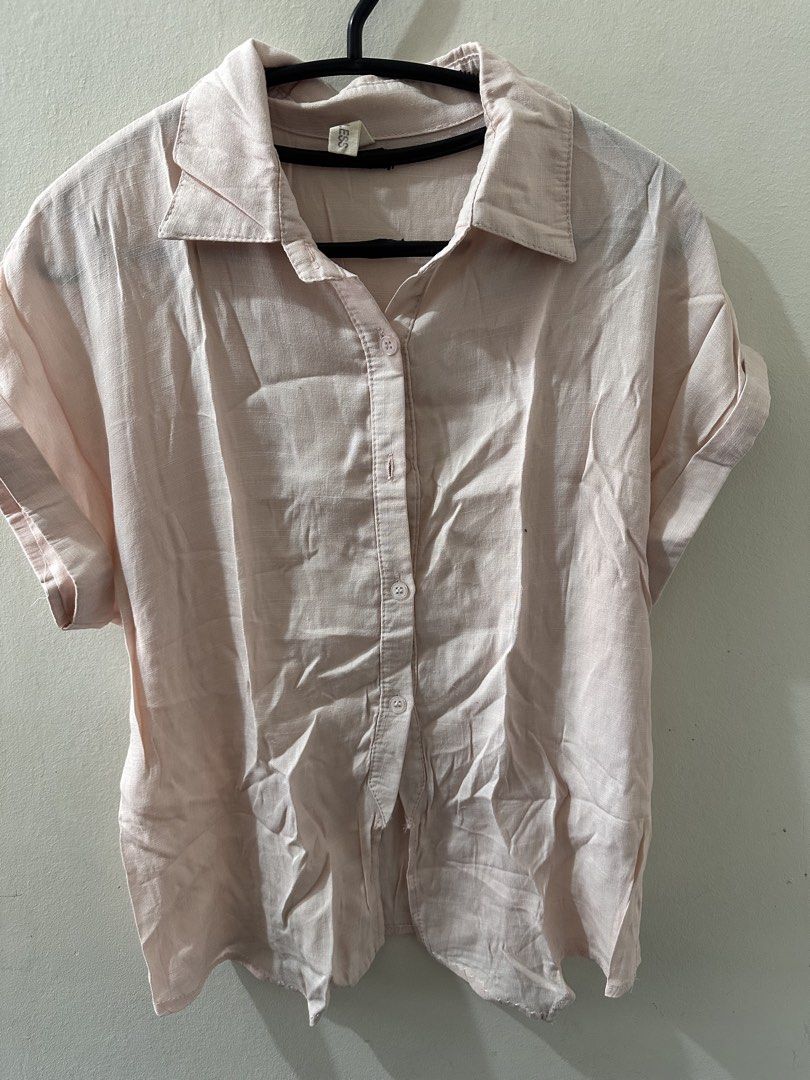 Pink Button-Down Blouse (Category: Blouses) located in Manila. Submitted by readysellgo (Listing ID 1436229195, Image 1). Description: Light pink button-down blouse with short sleeves. It features a collared neckline and a button-up front. The sleeves are cuffed. It is a versatile piece that can be dressed up or down..