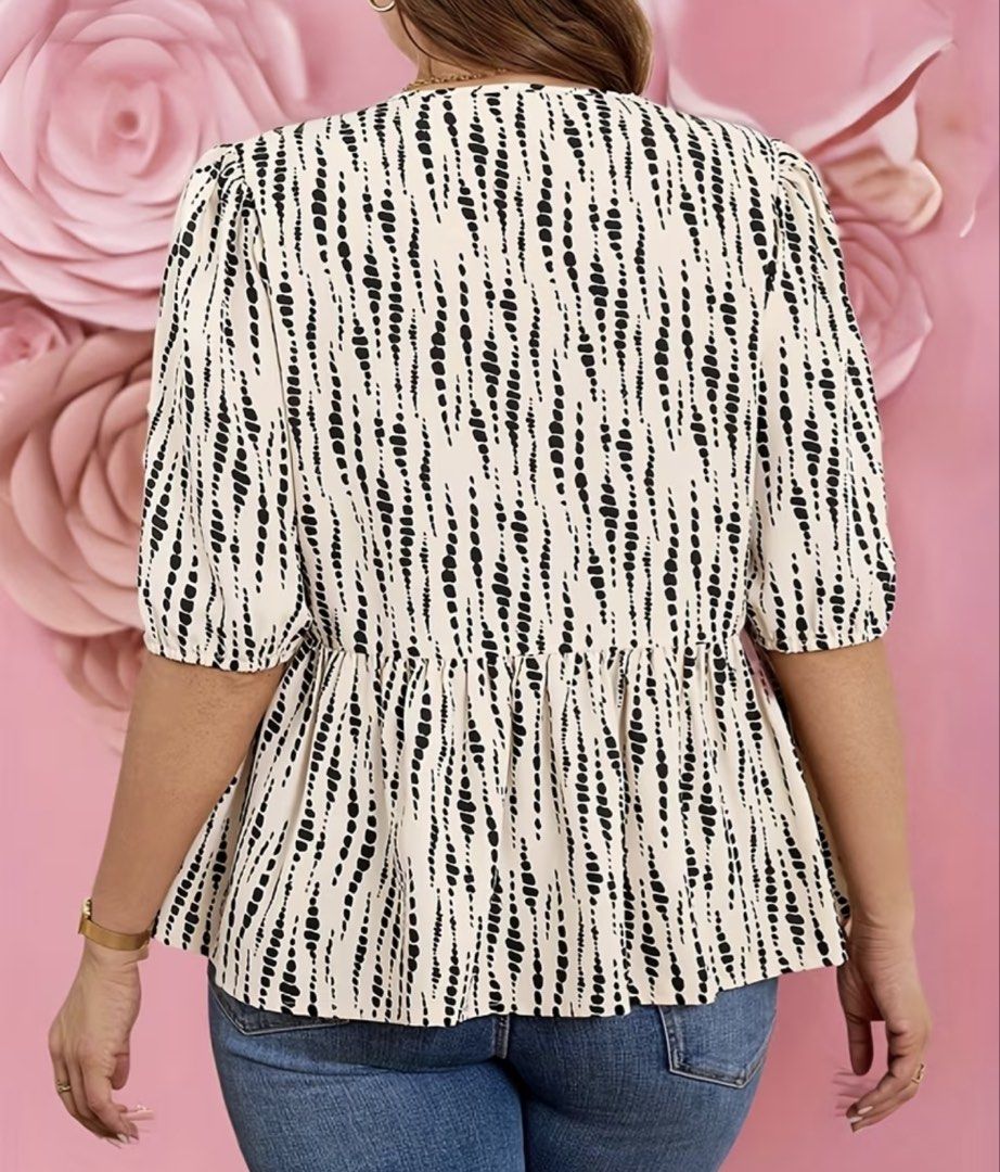 Plus Size Women's Top - 2XL (Category: Blouses) located in Cebu City. Submitted by itsmegeecebu (Listing ID 1436228354, Image 3). Description: - Plus-size top (2XL) - Unique black and white pattern - Round neckline with bow details - Short sleeves - Peplum hem - Waist tie - Chest: 124cm - Length: 72cm.