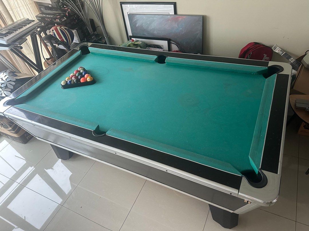 Pool table (Category: Others) located in Nusajaya. Submitted by grandbird.25cf76 (Listing ID 1436134772, Image 2). Description: American pool table works good, just chalk marks on green cloth, 7ft of shear fun, Slate bed 4 cues, was used in a bar at some point, I have had 10 years bought it for 4500 selling for 2500, buyer organise transport .