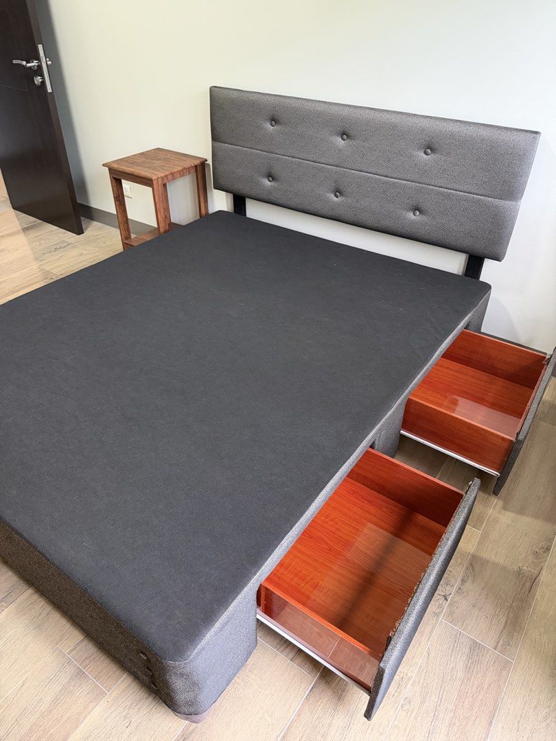 Salem Queen Size Bed Frame with Storage (Category: Bed Frames & Mattresses) located in Makati City. Submitted by inezlebron (Listing ID 1436228609, Image 2). Description: - Queen-size bed frame with storage - Dark grey fabric upholstery - Button-detailed headboard - Built-in storage drawers.