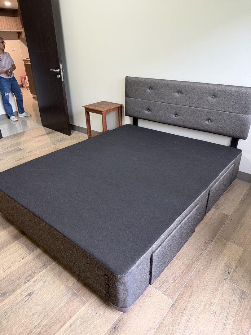 Salem Queen Size Bed Frame with Storage (Category: Bed Frames & Mattresses) located in Makati City. Submitted by inezlebron (Listing ID 1436228609, Image 1). Description: - Queen-size bed frame with storage - Dark grey fabric upholstery - Button-detailed headboard - Built-in storage drawers.