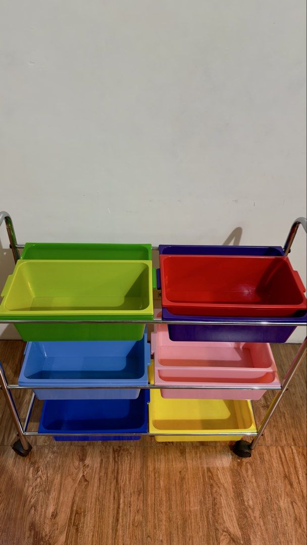 Seville Toy Storage Rack (Category: Other Kids Furniture) located in Manila. Submitted by lifestylehub (Listing ID 1436206829, Image 2). Description: - Six colorful bins for storage - Sturdy metal frame - Wheels for easy movement - Removable bins for cleaning - Perfect for playroom or classroom Bought this around 5k+ selling for only 1500! :) Rfs: will upgrade.