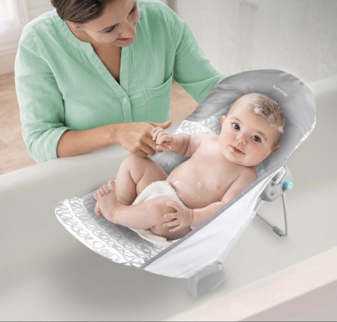 Summer Infant Baby Bath Tub (Category: Bathtub & Bath Accessories) located in Paranaque City. Submitted by ___iroiro___ (Listing ID 1436102026, Image 2). Description: - Summer Infant baby bath tub - Infant to 6months Old - Designed for comfortable and safe bathing - Features a supportive design - Includes a mesh sling for newborns - Color: Gray and white - Patterned seat - Includes safety warning label RFS: Outgrown and de-cluttering. Was very he