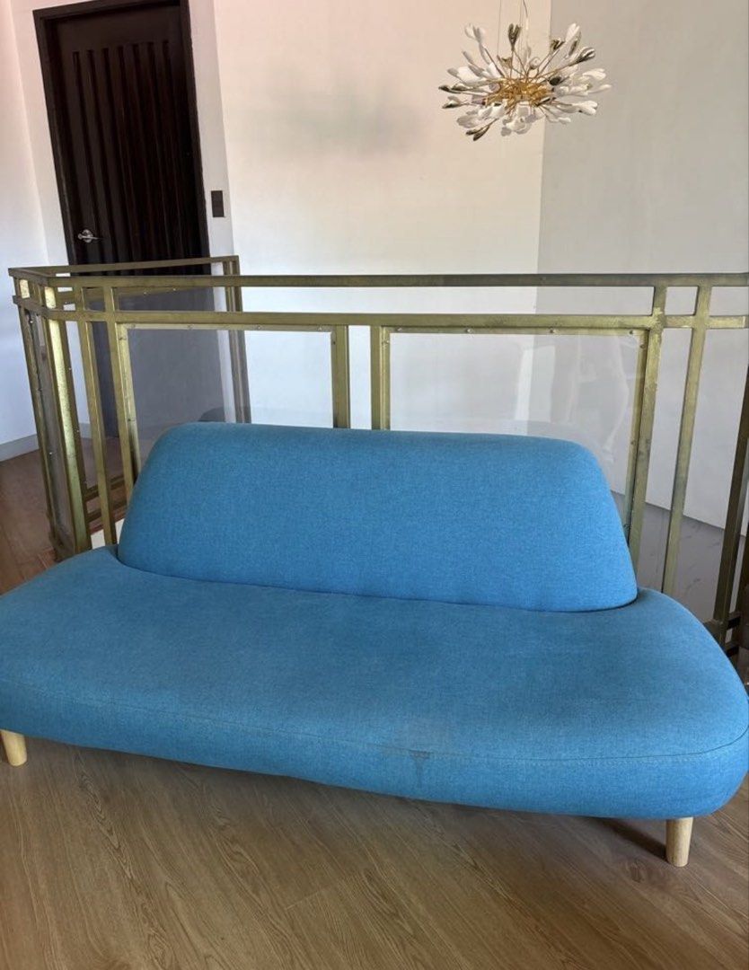 Teal Curved Sofa (Category: Sofas) located in Muntinlupa City. Submitted by ldb.nino (Listing ID 1435196790, Image 2). Description: - Stylish teal curved sofa - Modern design with rounded back and seat - Features wooden legs - Adds elegance to any living space 3-4 seater Has minimal stain Needs cleaning.