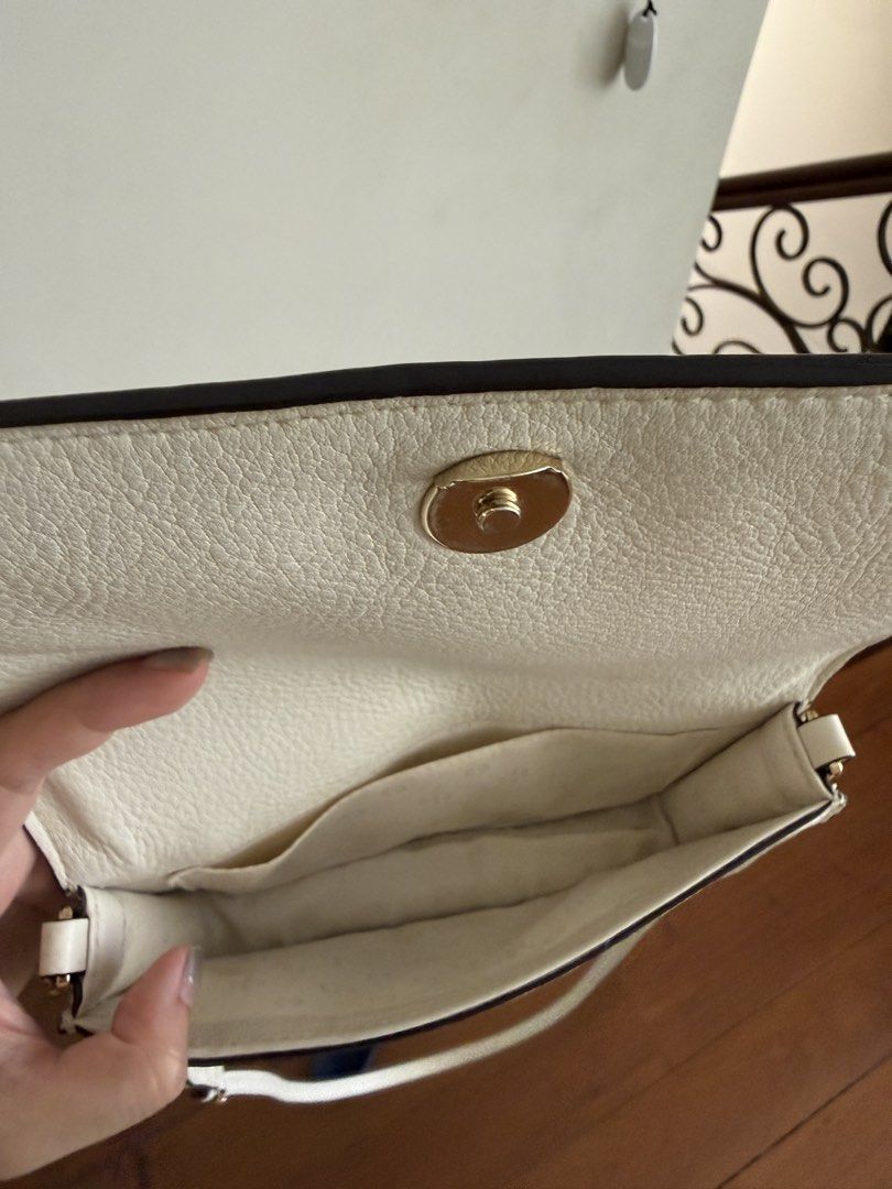 Tory Burch Crossbody Bag (Category: Luxury Bags & Wallets) located in Cebu City. Submitted by karenm14 (Listing ID 1436240662, Image 3). Description: - Cream-colored Tory Burch crossbody bag - Flap closure with gold-tone clasp - Embossed Tory Burch logo - Adjustable shoulder strap - Multiple interior compartments - Made of leather.