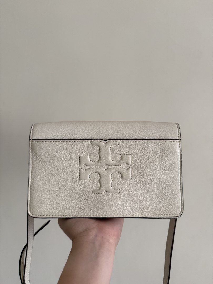 Tory Burch Crossbody Bag (Category: Luxury Bags & Wallets) located in Cebu City. Submitted by karenm14 (Listing ID 1436240662, Image 1). Description: - Cream-colored Tory Burch crossbody bag - Flap closure with gold-tone clasp - Embossed Tory Burch logo - Adjustable shoulder strap - Multiple interior compartments - Made of leather.