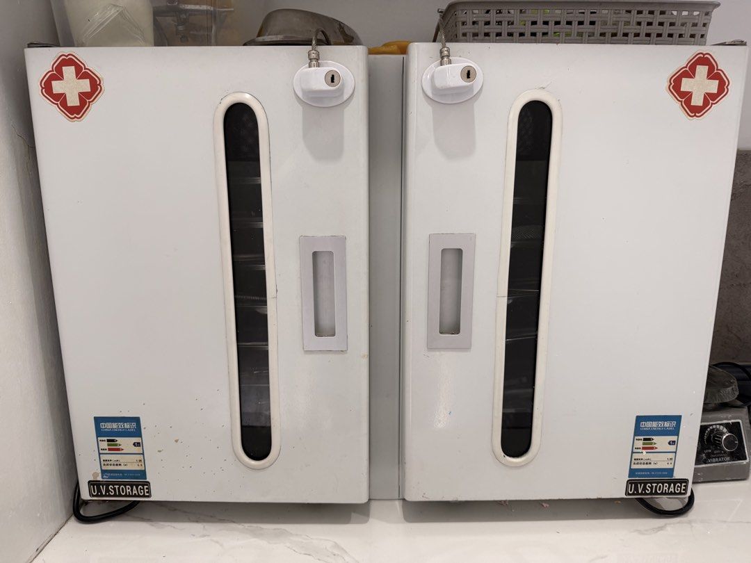UV Storage Sterilizer Cabinet (Category: Breastfeeding & Bottle Feeding) located in Quezon City. Submitted by r.tp07 (Listing ID 1436219593, Image 2). Description: - UV Sterilization Cabinet - Ideal for medical and dental instruments - Two separate compartments - Multiple trays for organization - Each compartment has a UV lamp - White exterior with red cross - Individual power switches for each compartment Rfs: declutterring .