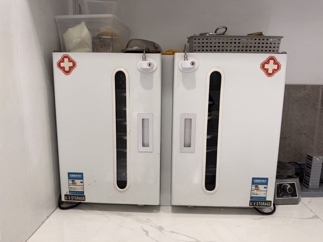 UV Storage Sterilizer Cabinet (Category: Breastfeeding & Bottle Feeding) located in Quezon City. Submitted by r.tp07 (Listing ID 1436219593, Image 1). Description: - UV Sterilization Cabinet - Ideal for medical and dental instruments - Two separate compartments - Multiple trays for organization - Each compartment has a UV lamp - White exterior with red cross - Individual power switches for each compartment Rfs: declutterring .