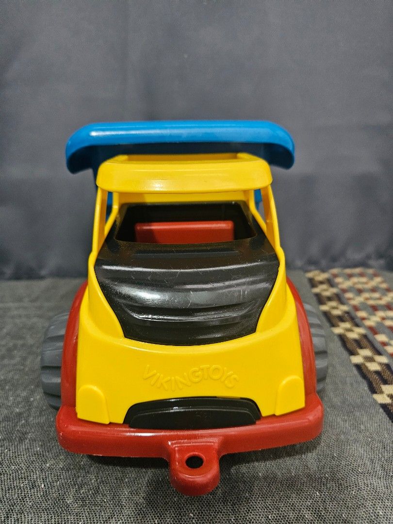 Viking Toys Dump Truck (Category: Kids Toys) located in Quezon City. Submitted by kcphilippines (Listing ID 1436121388, Image 2). Description: - Colorful Viking Toys dump truck - Features a blue dump bed, yellow cab, and red accents - Gray wheels with blue centers - Made of durable plastic - Safe, rounded edges - Suitable for indoor and outdoor play Kindly check photos or pm me for more details please. Shipping is not yet included in the price. W