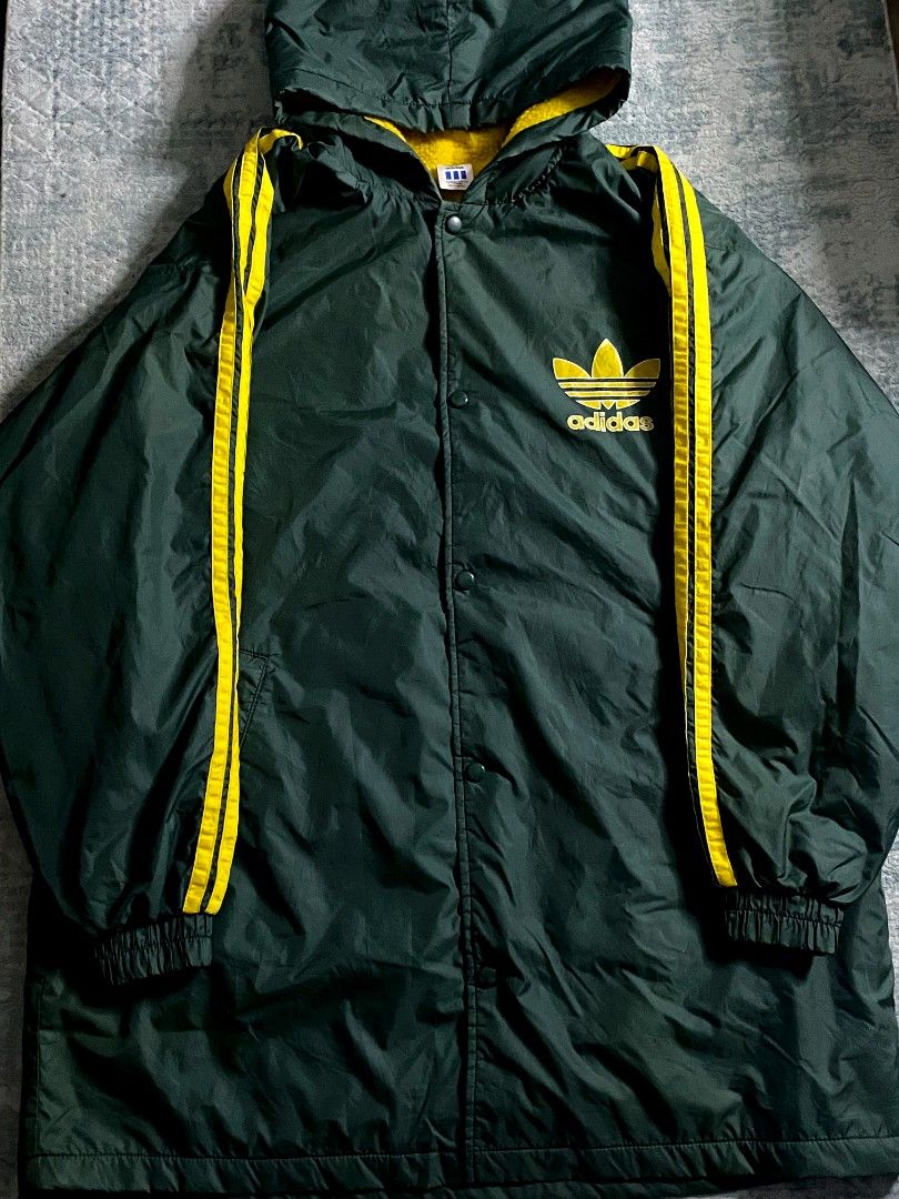 Vintage Adidas Big Logo Coach Jacket (Category: Coats, Jackets and Outerwear) located in Paranaque City. Submitted by anywear.ph_ (Listing ID 1436145096, Image 2). Description: Adidas Big Logo Coach Jacket Adidas x Descente Good Condition Sherpa fabric inside Dimes: 26 ½ x 34 ½ Issue : check last picture.