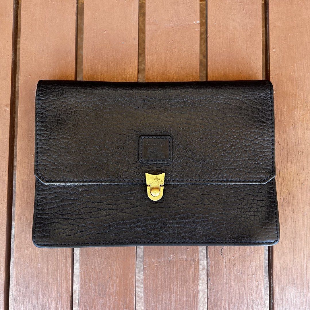 Vintage Burberry Clutch Bag Leather Authentic (Category: Luxury Bags & Wallets) located in Las Pinas. Submitted by _dontlikejustbuy (Listing ID 1436156295, Image 1). Description: Color: Leather Black Dimensions: - Height 17cm - Width 25cm - Depth 7cm - Strap 34cm Issues: Signs of usage. Stains on flap. .
