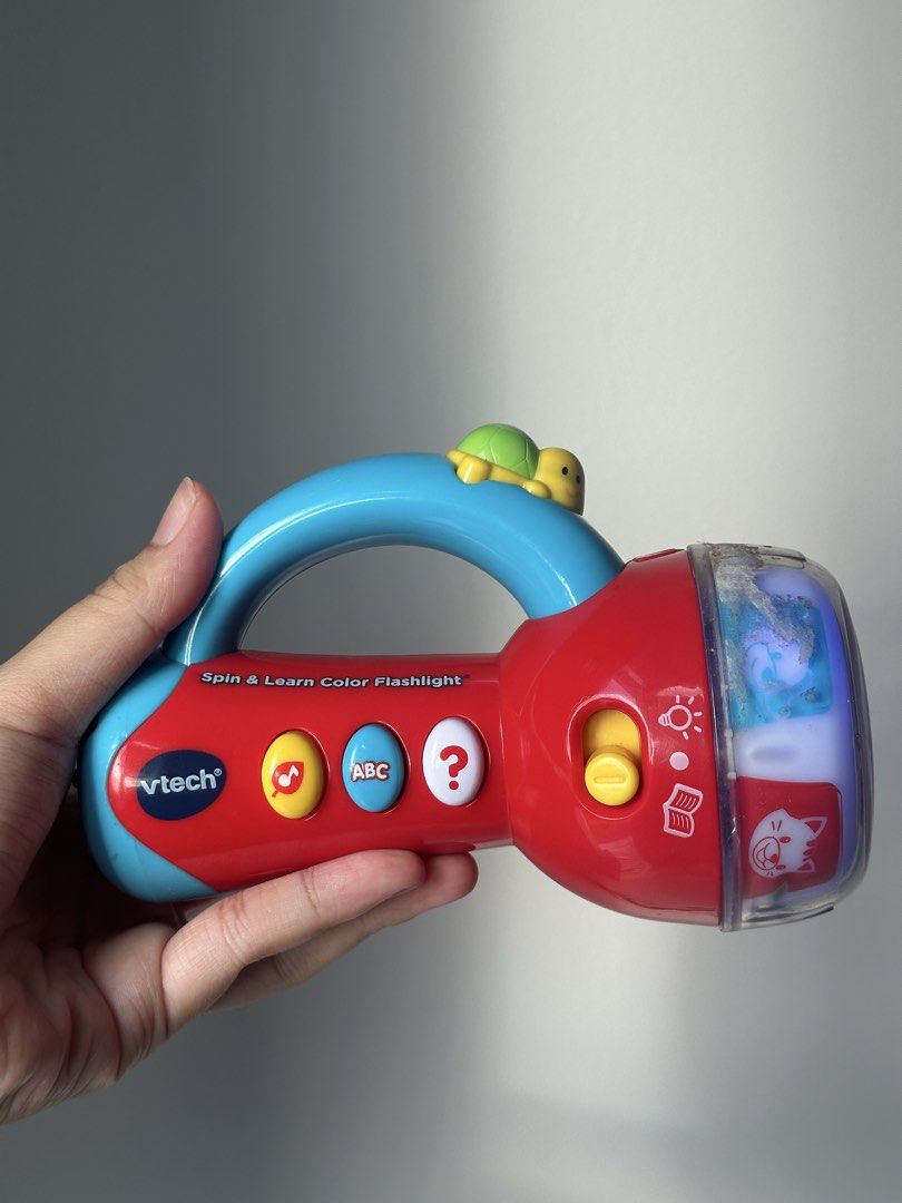 VTech Spin and Learn Color Flashlight Toy (Category: Educational & Learning Toys) located in Taguig. Submitted by declutzy (Listing ID 1436186809, Image 3). Description: Working with battery included Lights and sounds working well English Language All buttons are working.